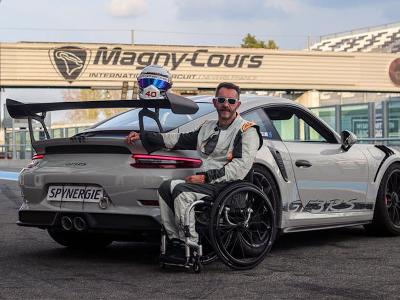 Porsche 911 GT3 RS at Magny-Cours with man in wheelchair