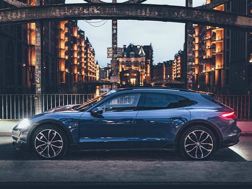 Porsche Taycan 4 Cross Turismo parked on a bridge