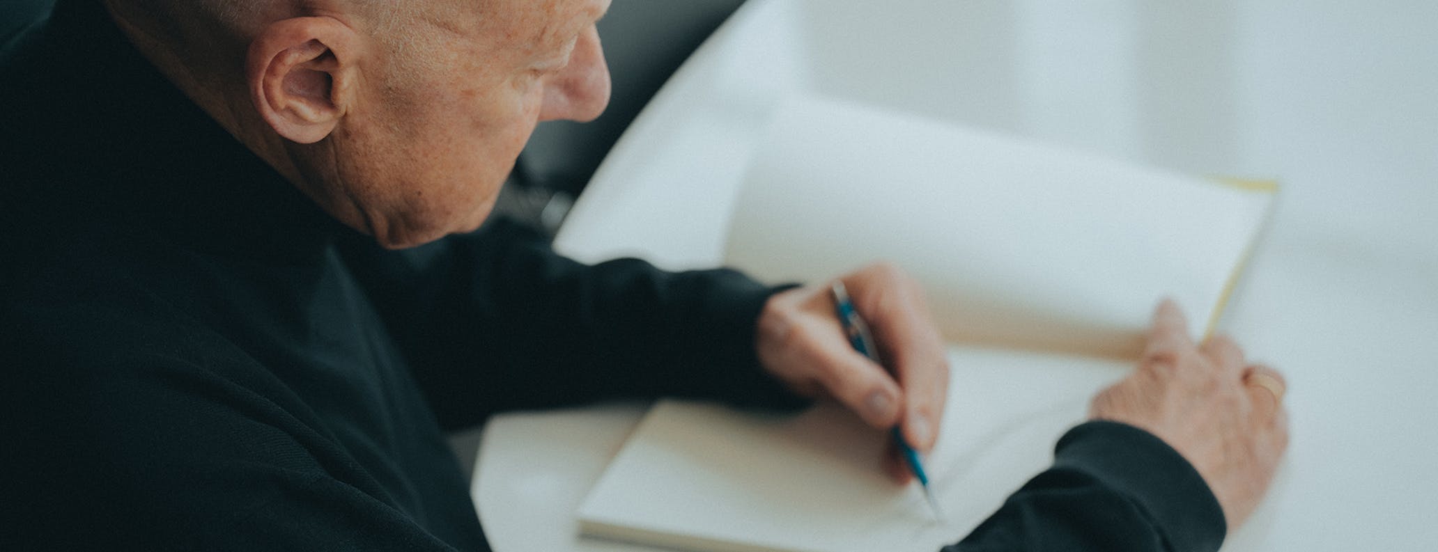 Lord Norman Foster sketching on notepad
